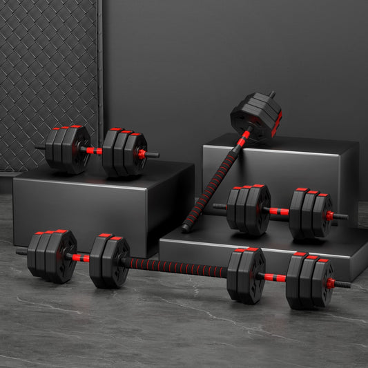 Set of black and red dumbbells on a dark gray surface with a dark background