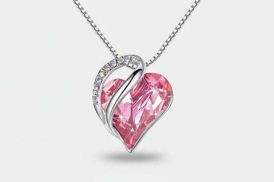 Pink heart-shaped pendant with silver frame on a white background