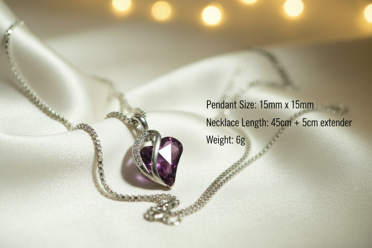 Heart-shaped purple gemstone pendant on a chain against a light green background