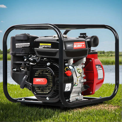 Duntz water pump on grass with a lake and sky background