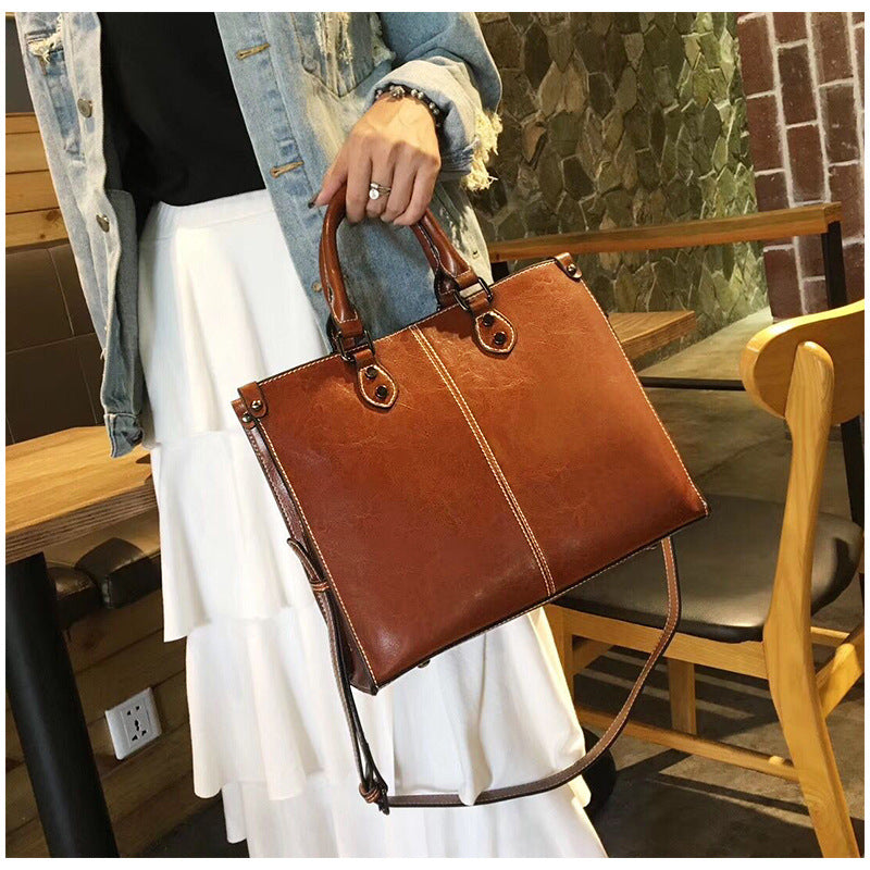 Black Elegant Leather Handbag - Stylish Brown Tote with Adjustable Strap, Spacious and Durable